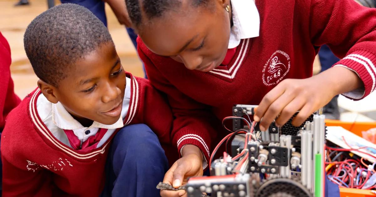 Two learners building and wiring a robot